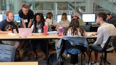 Accounting students helping others prepare their taxes